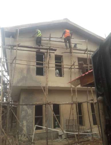 Before: facade with scaffolding during works — Alapere, Lagos
