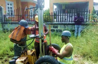Percussion drilling rig operated by the site team